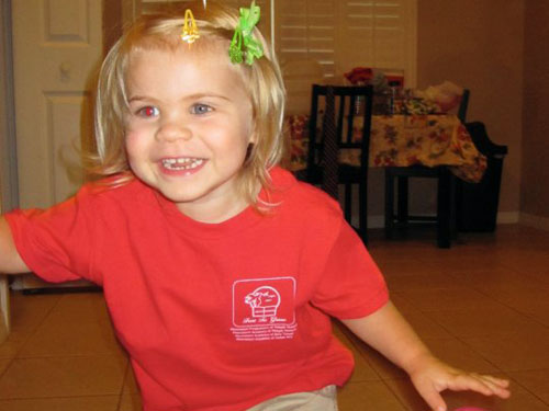 Rowan jumping for joy before her first day of school.