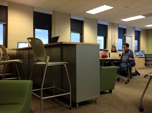 Photograph of students collaborating in a computer classroom