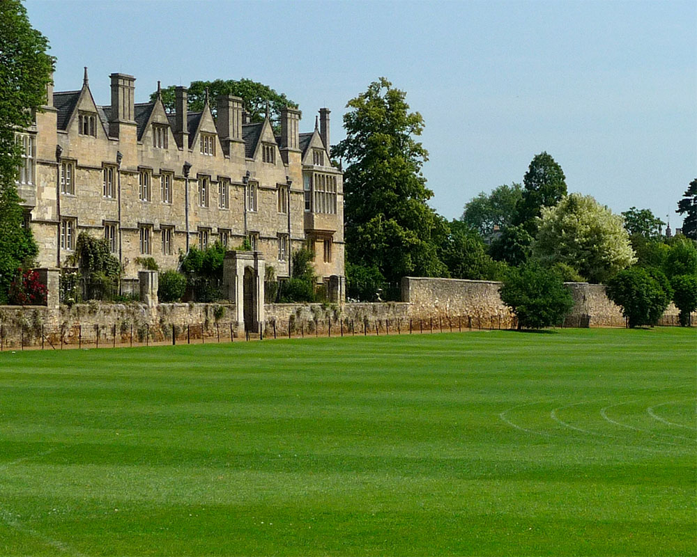 A stately manor and a green lawn