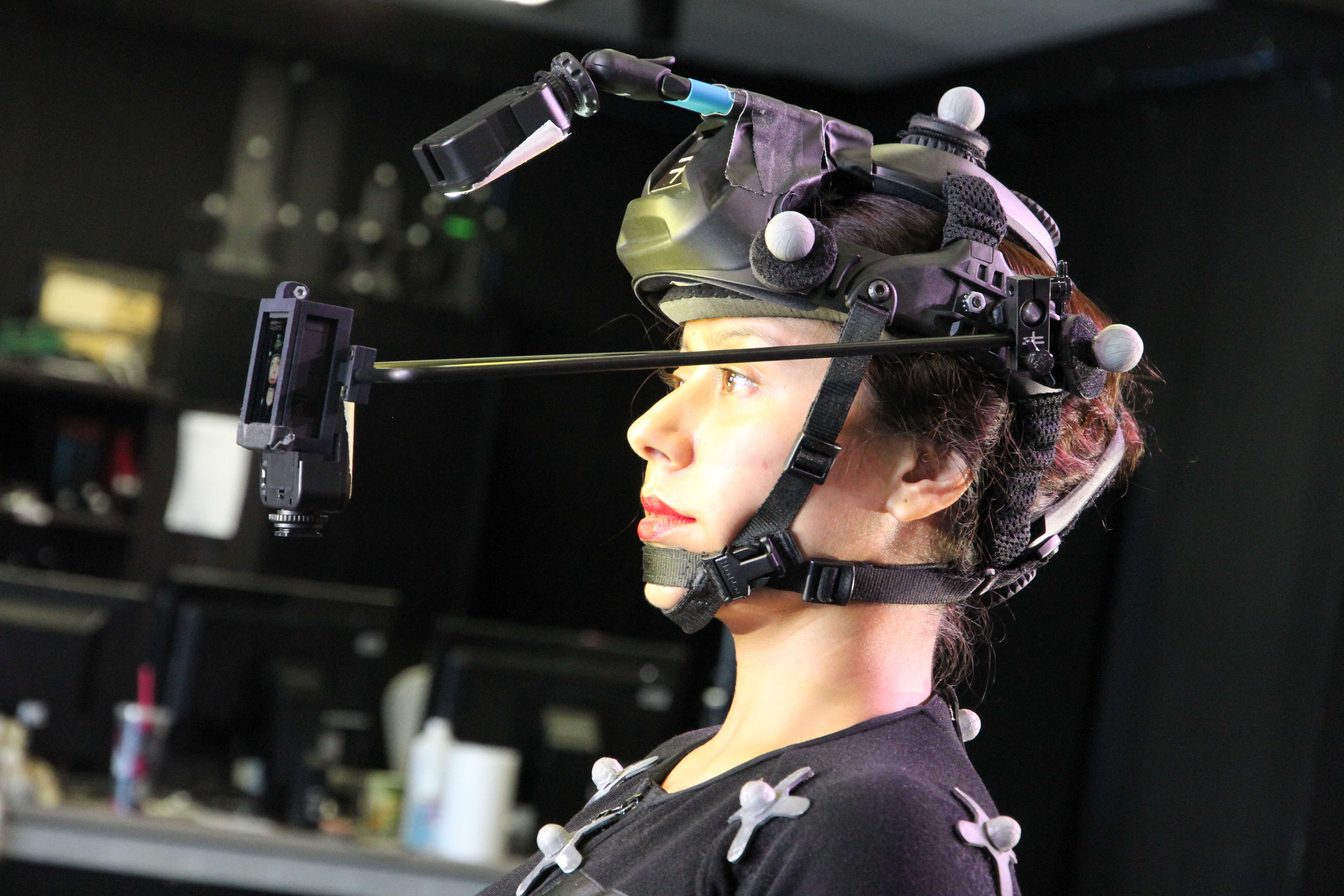 woman wearing helmet with turned-off light bulbs on it and a protruding fixture on the front