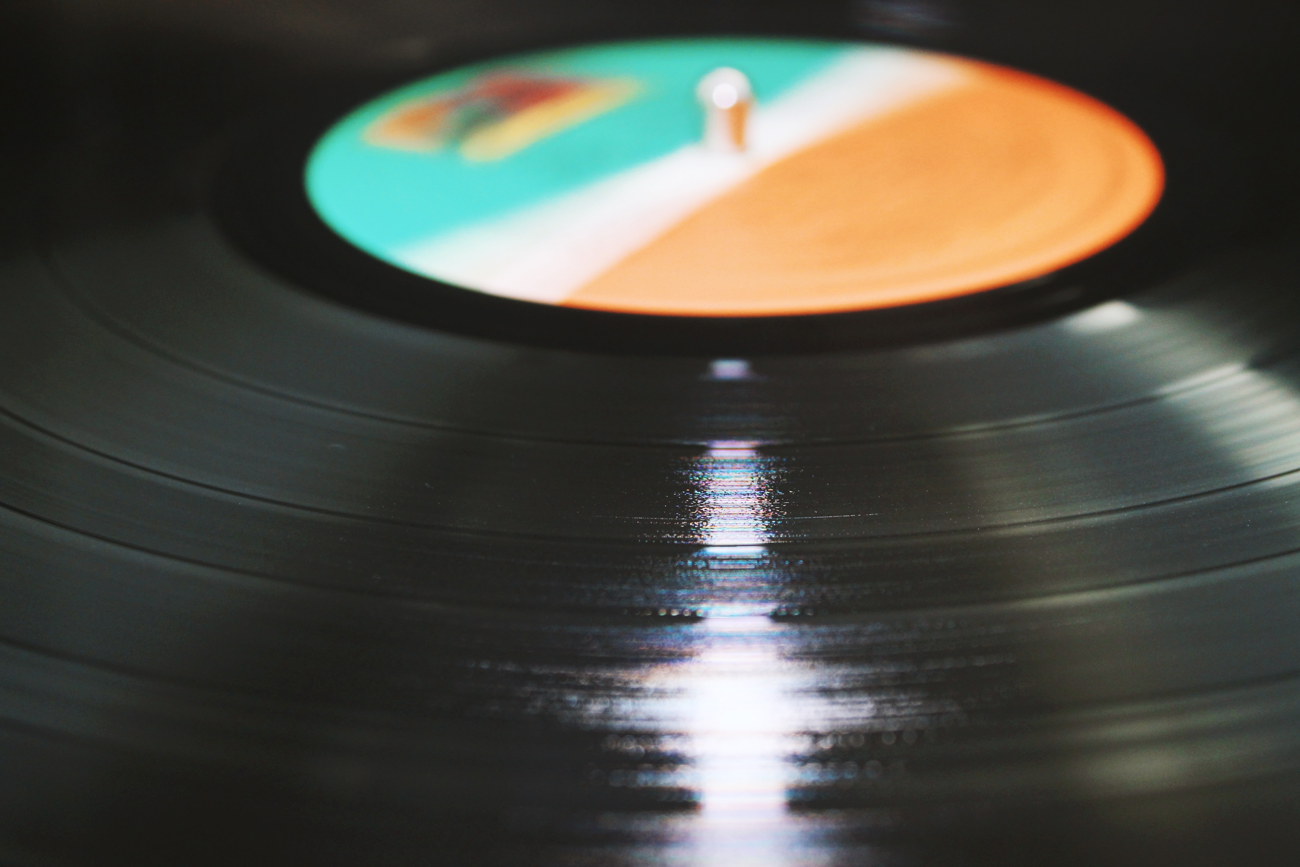 A close-up photograph of a spinning record